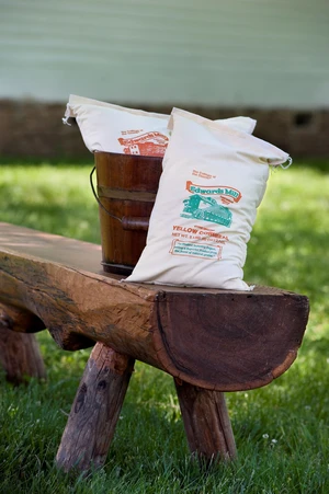 Picture of bags of flour on a bench.